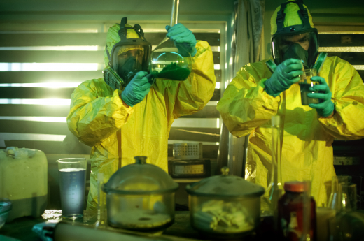 People wearing green and yellow Personal Protective Equipment